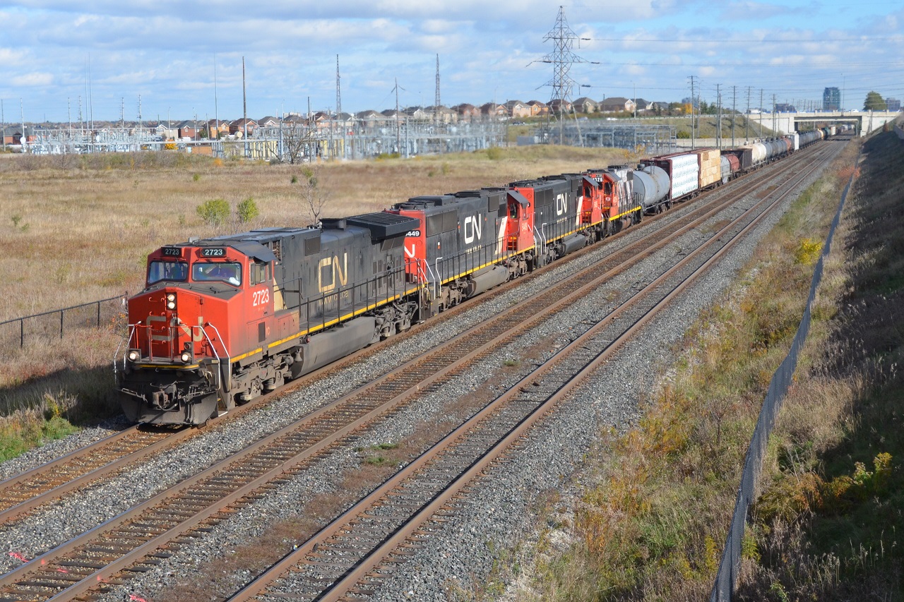 CN A435 heads West approaching the Bouvaird mile board with a pair of SD60s that are now out in service once again