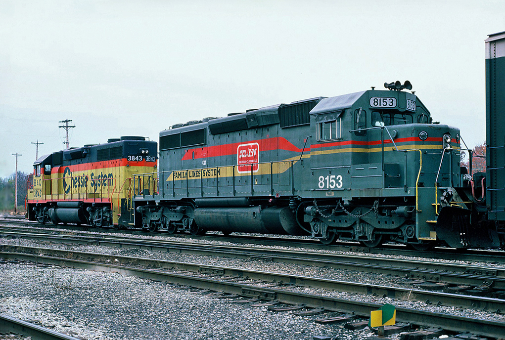 W/B CSX freight in CP's Montrose yard with Chessie System (B&O) GP38 No.3843 and Family Lines System (SBD) SD40-2 No.8153. October 22,1987.
