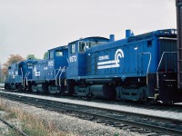 Conrail EMD GP10 No.7534 a rebuilt GP9, with two EMD SW1500s  at Fort Erie, Ontario  October 21, 1986.