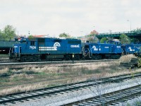  Conrail GP38 7936 and SW1500 9578, 9571 at Fort Erie. October 23, 1987.