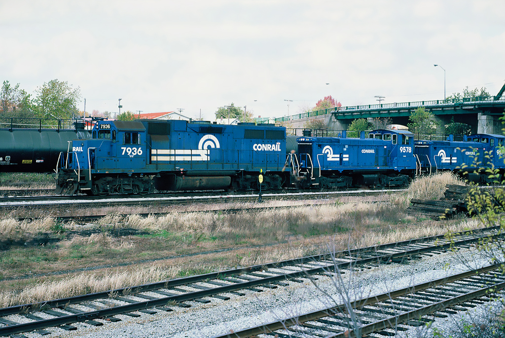 Conrail GP38 7936 and SW1500 9578, 9571 at Fort Erie. October 23, 1987.