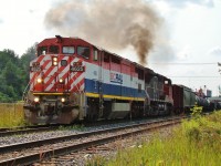 An eastbound manifest departs London bound for Toronto behind BC Rail 4625 and CN 2647.