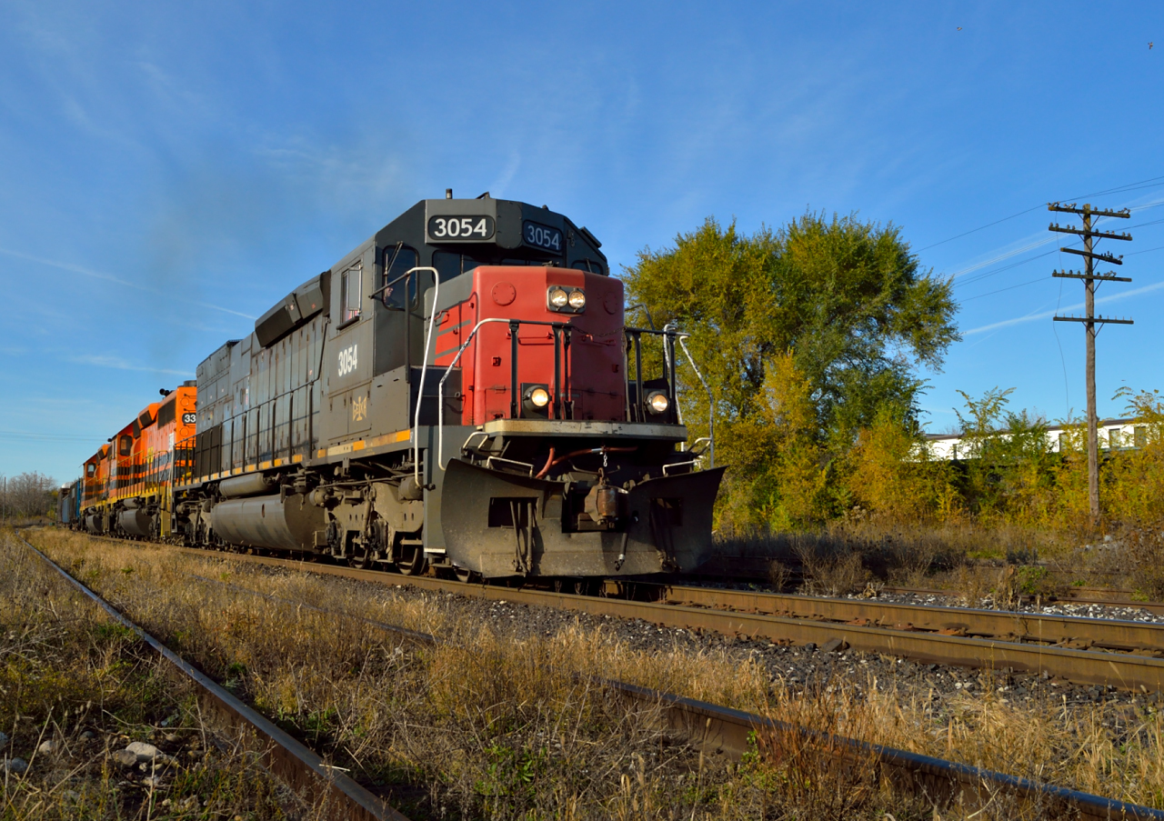GEXR 432 heads eastbound through Guelph with 69 cars on the drawbar for CN at Mac Yard.  The last of the fall colours is almost upon us...soon the white stuff will be flying...