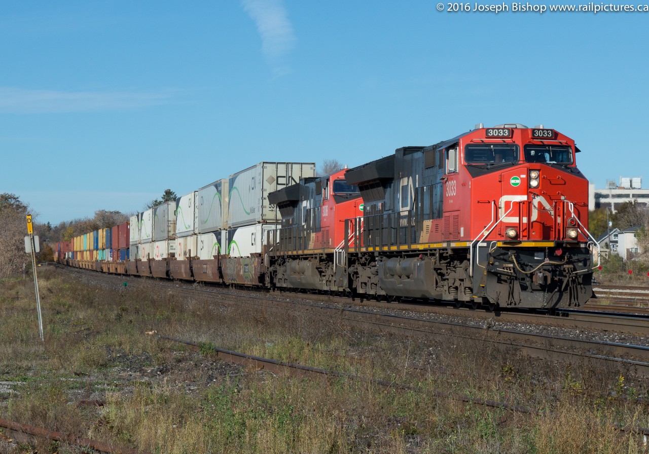 On a sunny but cold November morning, CN 148 drops downgrade through Brantford with CN 3033 and CN 3008 providing the ponies.