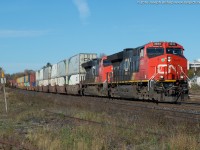 On a sunny but cold November morning, CN 148 drops downgrade through Brantford with CN 3033 and CN 3008 providing the ponies.