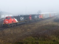 CN 371 emerges from the thick fog that blanketed much of Brant County on Thursday morning with a pair of Tier 4 GEVOs on the point.  The fog patterns were quite odd that morning, most of my drive to Brantford was sunny but upon hitting Highway 2 and Cainsville it was pea soup!