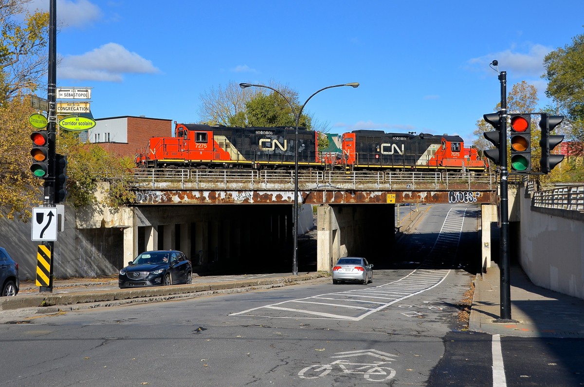 GP9's CN 7275 & CN 7075 are going back and forth over Wellington street as they work Pointe St-Charles Yard.