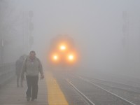 AMT 84 is barely visible as it slows down to stop at Lasalle station in very thick fog.
