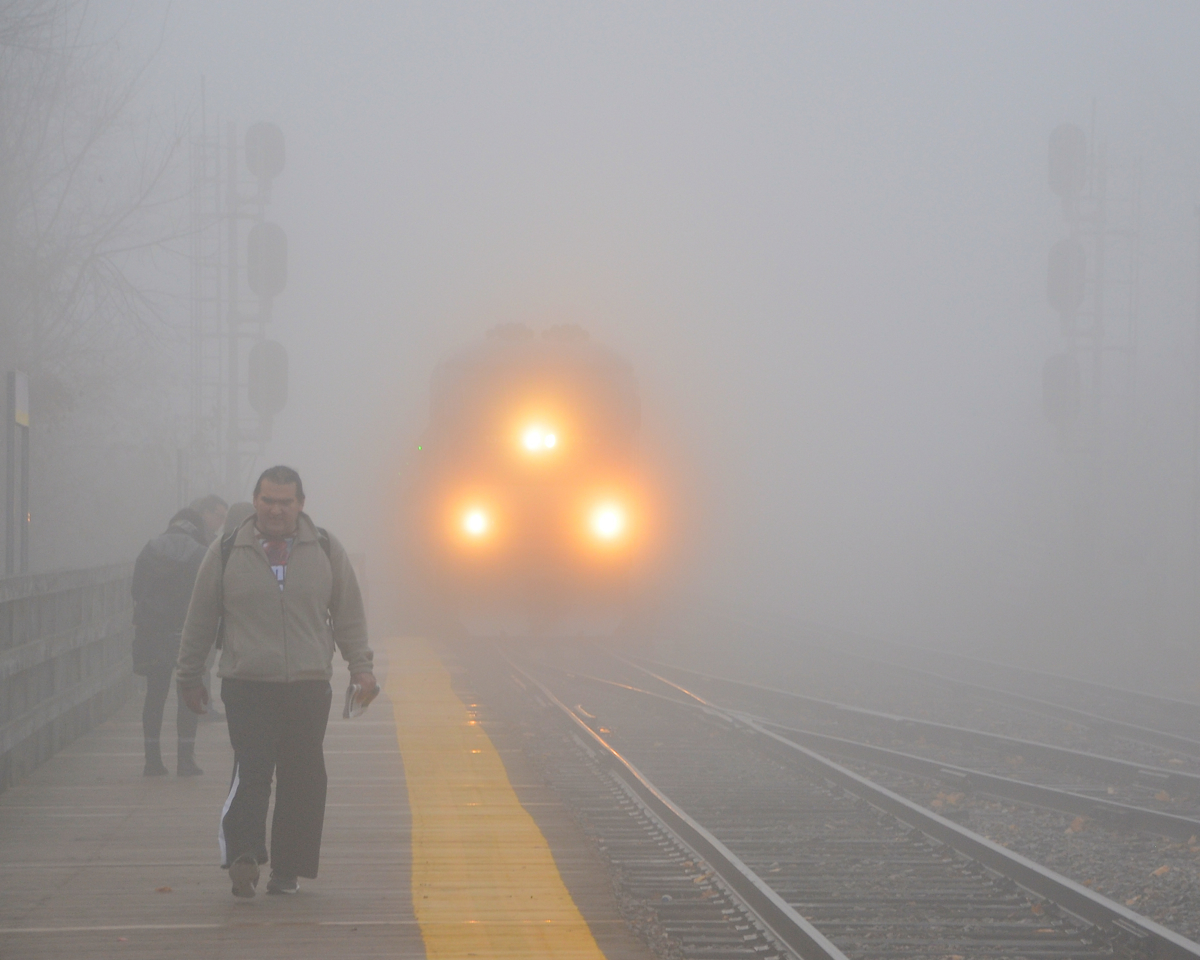 AMT 84 is barely visible as it slows down to stop at Lasalle station in very thick fog.