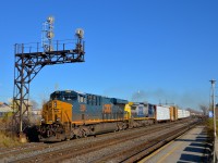CSXT 3148 & CSXT 7347 lead an 85-car CN 327 as it roars through Dorval Station at a furious pace.