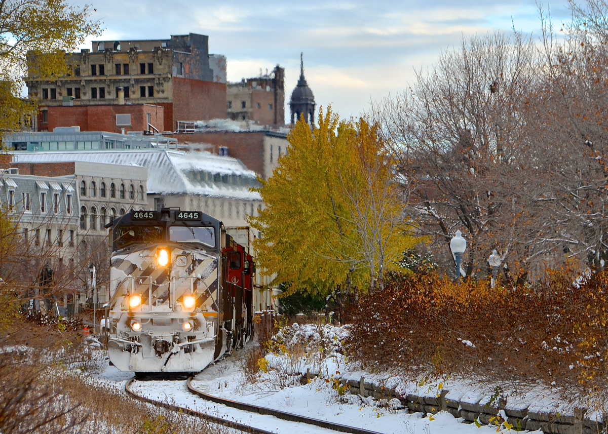 The day after Montreal got a bit of snow, BCOL 4645 leads CN 149 out of the Port of Montreal, with a small amount of fall colours still visible.