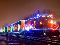 A pair of kids stare up at the U.S. version of the CP holiday train in Delson. It is making its second stop of the evening on the first day that it runs. In a few hours the train will cross the border and deadhead down the D&H.