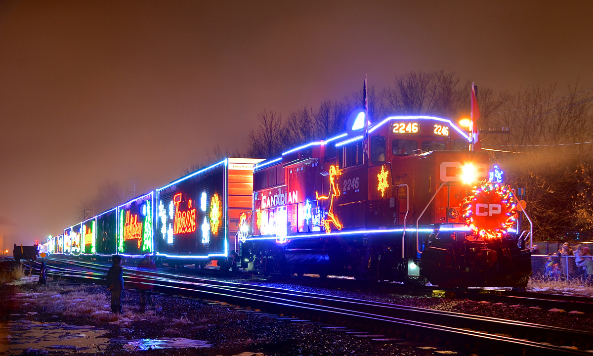 A pair of kids stare up at the U.S. version of the CP holiday train in Delson. It is making its second stop of the evening on the first day that it runs. In a few hours the train will cross the border and deadhead down the D&H.