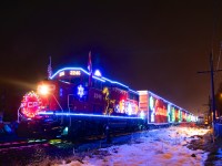 A year after I shot the U.S. version of the CP holiday train at Delson in the rain, I was able to shoot it at the same location with a bit of snow on the ground. Here CP 2246 and the rest of the holiday train sits at Delson, in a few hours the train will cross the border and deadhead down the D&H.