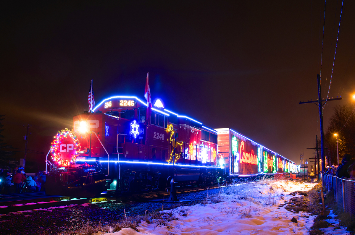 A year after I shot the U.S. version of the CP holiday train at Delson in the rain, I was able to shoot it at the same location with a bit of snow on the ground. Here CP 2246 and the rest of the holiday train sits at Delson, in a few hours the train will cross the border and deadhead down the D&H.