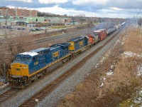 A pair of older CSXT units that have been recently repainted into the current boxcar paint scheme (ex-Conrail Dash8-40CW CSXT 7383 & ex-L&N SD40-2 CSXT 8006) are joined by even older GP9 CN 4135 (to be set off at Coteau, along with part of the train) on CN 327 which is westbound through Pointe-Claire at MP 14 of CN's Kingston Sub.