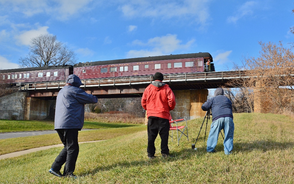 The 2016 Fan Crew gets a wave from Santa, err Brakeman riding heavy weight Business Car #77 the Van Horne, the tail end car of the CPR Christmas Train on the Ganaraska Viaduct.
 

The 2016 Fan Crew from Bolingbroke; Scarborough and Toronto.
 

At Port Hope 12:56 November 28, 2016 digital by S. Danko