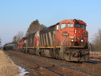 There is only as trace of snow on the ground as CN train 435 rolls back onto the double track at Steeartown after crossing over Black Creek. Today's train has some older power for its consist, which was a nice change from the endless parade of newer GE and EMD units typically on most trains in the area these days. Up front is a pair of cowl Dash-8s, followed by a SD40 and a GP9 in transit to London.