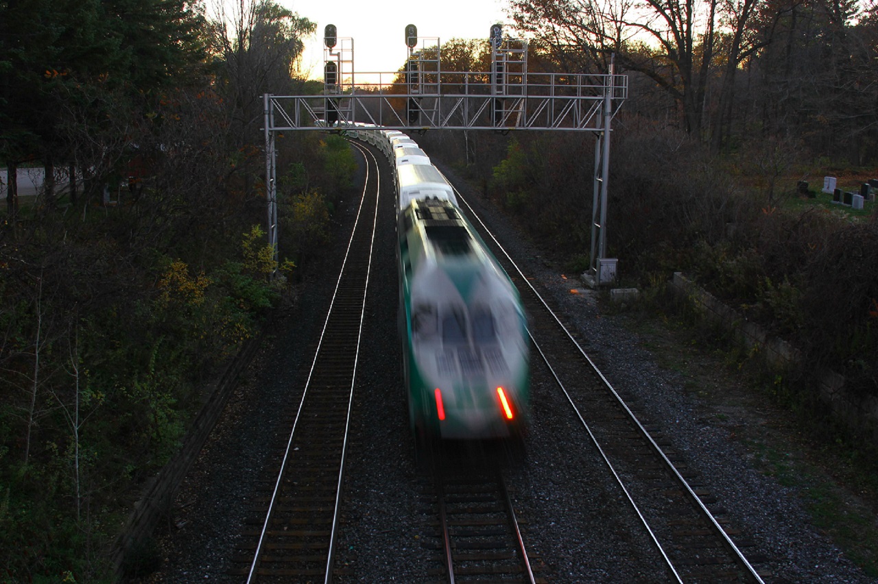 A GO train heads towards Hamilton at CN Snake on an cool, autumn dusk (time was just after 17:00).