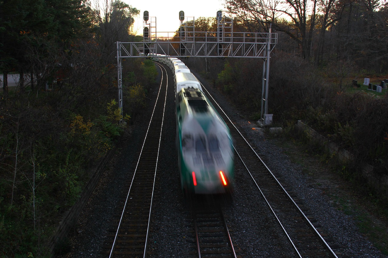 A GO train heads towards Hamilton at CN Snake on an cool, autumn dusk (time was just after 17:00).