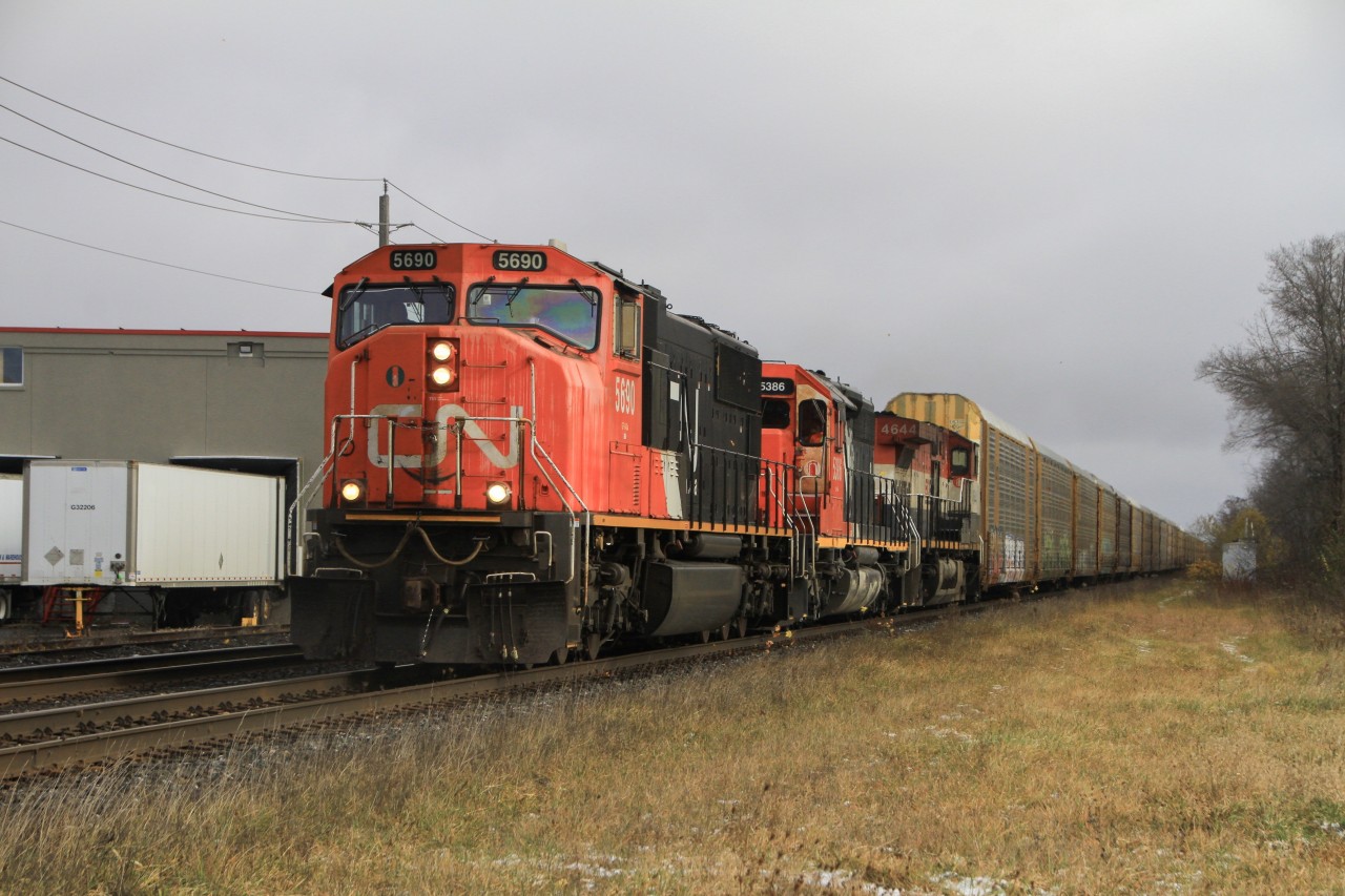 During a break of on and off snowstorms, 371 flies through Woodstock on the south track after meeting 148 seconds before. I'm very fortunate that the sun just barely broke through the thick cloudcover, and made the shot a ton better.