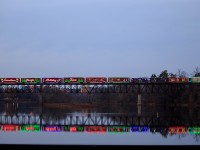 High above over the Grand river 02H slowly rolls across as it departs Galt.