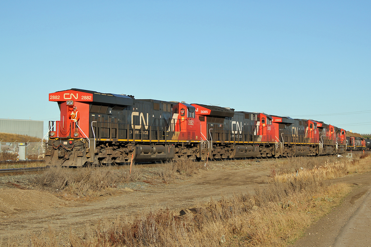 On a sunny, unseasonably warm November afternoon an interesting light engine movement is coming out of Clover Bar yard. ES44AC CN 2882, ET44AC CN 3085, ES44AC CN 2869, ET44AC CN 3009 and at the far end, presumably doing the driving as there is a crew member on the front plate, SD70M-2 CN 8938.