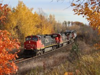 The fall colours maybe fading quickly but there are still some decent pockets of colour left. Scotch Block at mile 30 of the Halton subdivision has been a great spot this year for late colour. Here train 394 with a trio of GE built units grinds its way east past the Clublinks golf course.