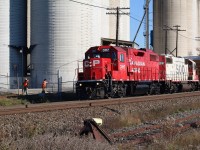 While it certainly doesn't happen as often today as it once did, the one time Reid's Mill, now Ardent Mill still receives cars from time to time. SOO Line GP38 429 in the consist this day was a bonus. Here we see the crew opening the gates so that four covered hoppers can be dropped off inside the facility. The currently unused ADM spur is in the foreground.