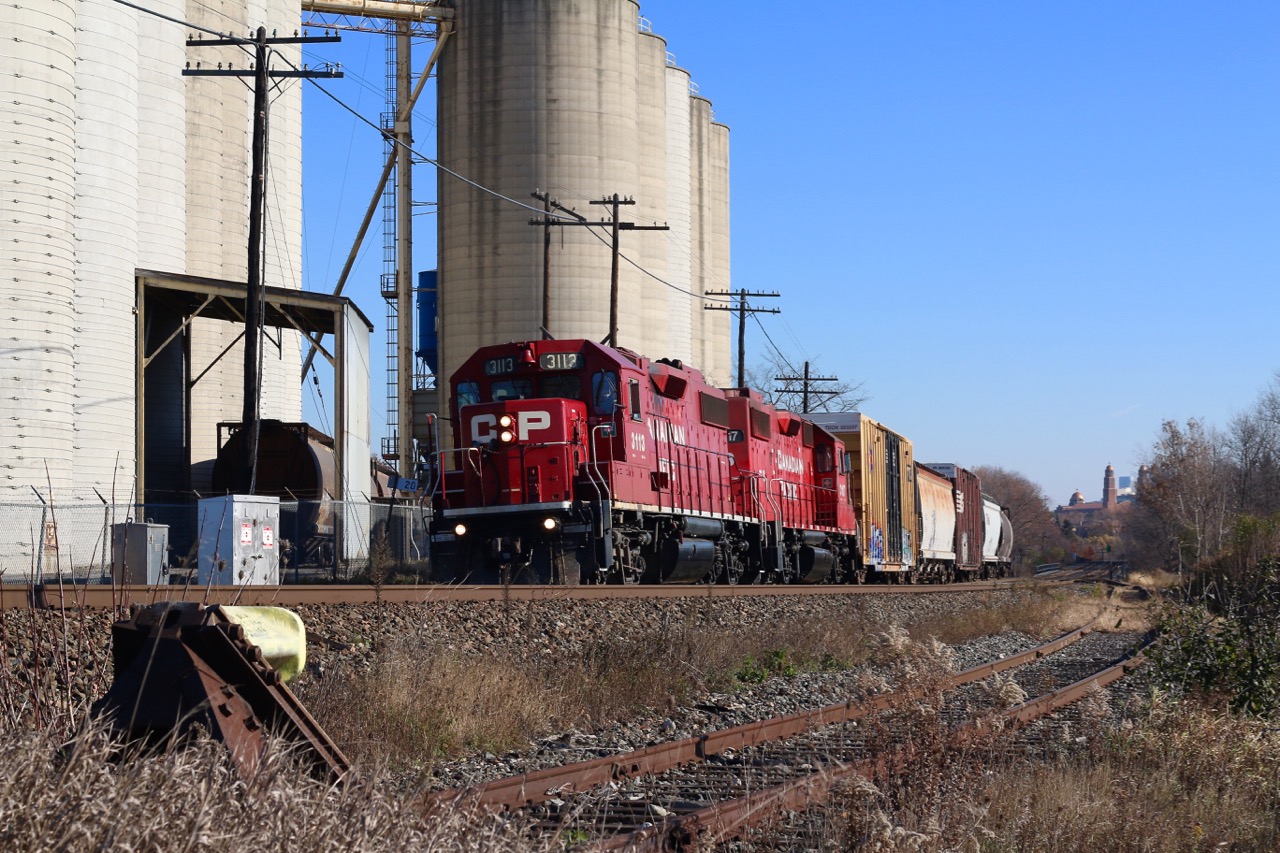 Another Monday's call to duty finds CP T14 stopping to switch out the large Ardent Mill in Streetsville. The ADM spur sits dormant to the right.