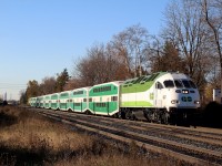 GO Transit/Metrolinx's only "Tier 4" MP40PH #647 slowly pulls away from Clarkson station after being delayed by PNR crews removing some debris off the tracks. The small yard for Suncor can be seen in the distance off to the left.