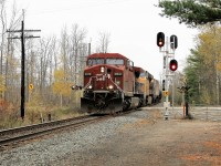 The end of the searchlight signal era is upon us. The new ABS signals are illuminated for CP 651 with CP 9618 leading UP 5538 across the 14th Concession, headed west cleared to Orr's Lake with its manifest of empty ethanol cars.