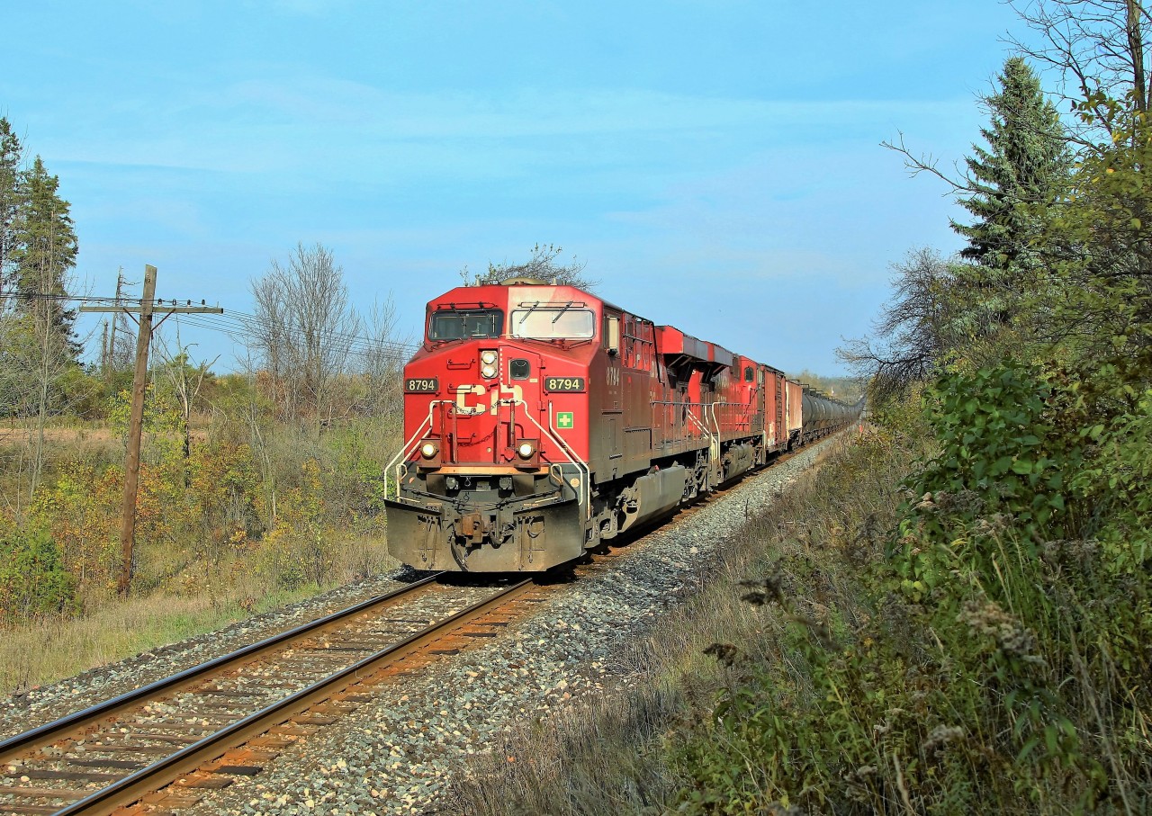 Empty ethanol train CP 654, led by CP 8794 with CP 8815 for added power, cruise up the grade approaching MM45 where they will stop on the main line and wait for T69 to enter the siding at Puslinch.