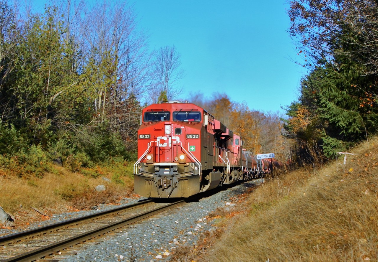 CP 246 led by CP 8832 with 8762 head their way down the Hamilton sub on their way out of Guelph Junction on a bright fall morning. This train came within the 5 minute window that eliminated the shadows from the trees on the engines and CTC sign, but still lit up the side of the train.
