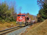  CP 246 led by CP 8832 with 8762 head their way down the Hamilton sub on their way out of Guelph Junction on a bright fall morning. This train came within the 5 minute window that eliminated the shadows from the trees on the engines and CTC sign, but still lit up the side of the train. 