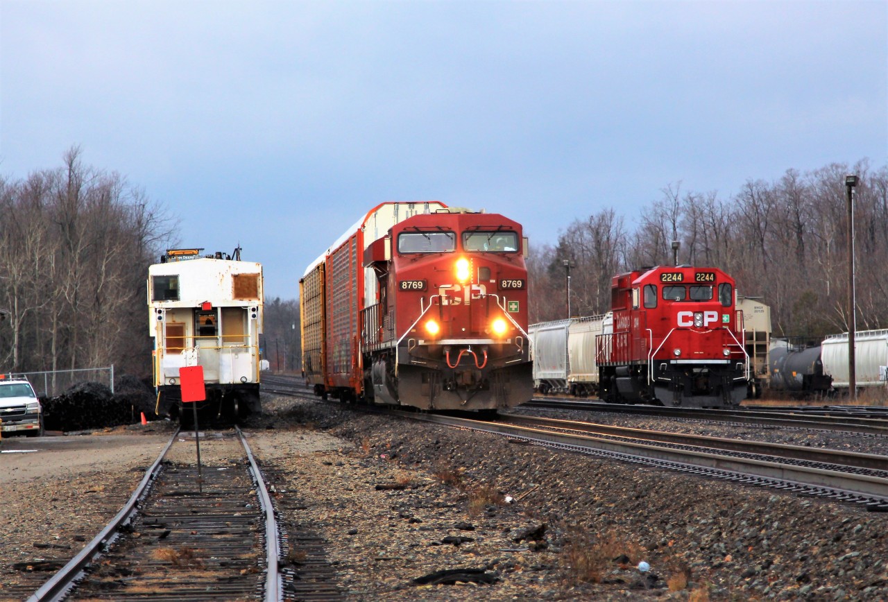 CP 8769 leads a short 24 axel train through Guelph Junction splitting CP 2244 idling on the north and a CP work crew preparing to depart with the Ministry of Engineering van in tow.
I don't know, but it seems CP has been running a lot of light power or very short trains in the last month with some of the daily regulars even getting cancelled. On a 3 day run, ever faithful CP 147 had 1 car total with two light powers.