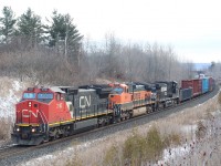 The grey winter days are not far off now. Here we have one of CN's former BNSF Dash-8s leading a BNSF and NS Dash-9 up the slight grade at Scotch Block. This photo shows how similar the two engine models are externally, with the trucks being the main spotting feature. The "gull wing" cab roof contour was a ATSF/BNSF special order, which allowed the units to fit through on line coal loaders. 