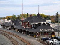 It is great that the Kenora CP station complex has been designated 'Heritage',(1991) as it is a beautiful sight. This view was taken from the Matheson St overpass at the west end of the yard. Kenora station was constructed back in 1899. The left foreground, a parking area for staffers and employees, was once a beautiful garden, complete with lush grasses and endless flowers. The idea was for new Canadians heading west to start a new life would see the beauty at station stops and give them encouragement for what lied ahead. Boy were they in for a surprise!!! There was no beauty in landing somewhere in Saskatchewan or Southern Alberta and fending oneself against a prairie winter. Many newbies stuck it out though, and as the years passed the railroads, as the major highways in the east, cut back on "beauty" as a non-contributor to the bottom line and neglect took over.