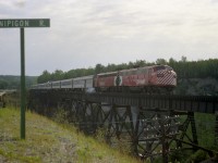 CP 1416 and 1410 power the Canadian westward over the Nipigon River bridge in this late morning image taken from the side of Highway 17, just over 40 years ago as of this posting. Back then this train was daily, rolling thru town around the noon hour when on time. CP 1410 sold to VIA, overhaul completion 2/28/79 at Ogden, and CP 1416 also to VIA, overhaul completion 11/30/78. They became VIA 6558 and 6564.