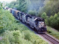 Northbound New Brunswick East Coast freight with in the lead GMD SD40 6900, CFMG SD40  6907 and NBEC SD40  6905 leaving Bathurst, N.B. July 17, 2004.