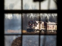 Ontario Southland's thrice weekly job to St. Thomas trundles by an old barn on the outskirts of town. Thanks goes to GJM for letting me use his long lens for this shot, and providing stories of St. Thomas' glory days in the 1970s.