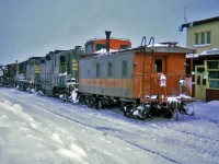 QNS&L GMD GP9 132 and 126 with Caboose No.44 and a Jordan Spreader No.27 used as a snow plow at Schefferville, Quebec December 27, 1969.