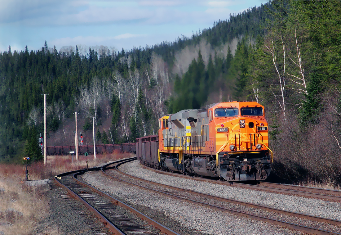 QNS&L southbound with loaded iron ore cars, AC4400CW 418 and SD70ACe 504 waiting for a northbound at Doree, Québec April 16, 2010.
