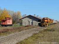 With some fall colour still abound - a rare weekend extra sees GEXR 516 with 17 cars of potash heading west for Agromart at Kellys (near Belton, Ontario). GEXR 516 is passing the former St. Marys station, built by the Grand Trunk in 1858 and used in railway service until the 1970's mostly as a  train order office for trains to/from the Forest sub. St Mary's more modern (1907) station is in use for VIA Rail closer to downtown. Note the GTW Caboose placed at the junction - which is now used as a off leash dog park. The caboose has seen better days. Why would a GTW Caboose be considered for St. Marys - a loose connection to the former Grand Trunk?? The Canadian Grand Trunk ceased to exist upon joining the CNR in 1923 - the connection between the two, in my humble opinion, is a loose one based on name only.