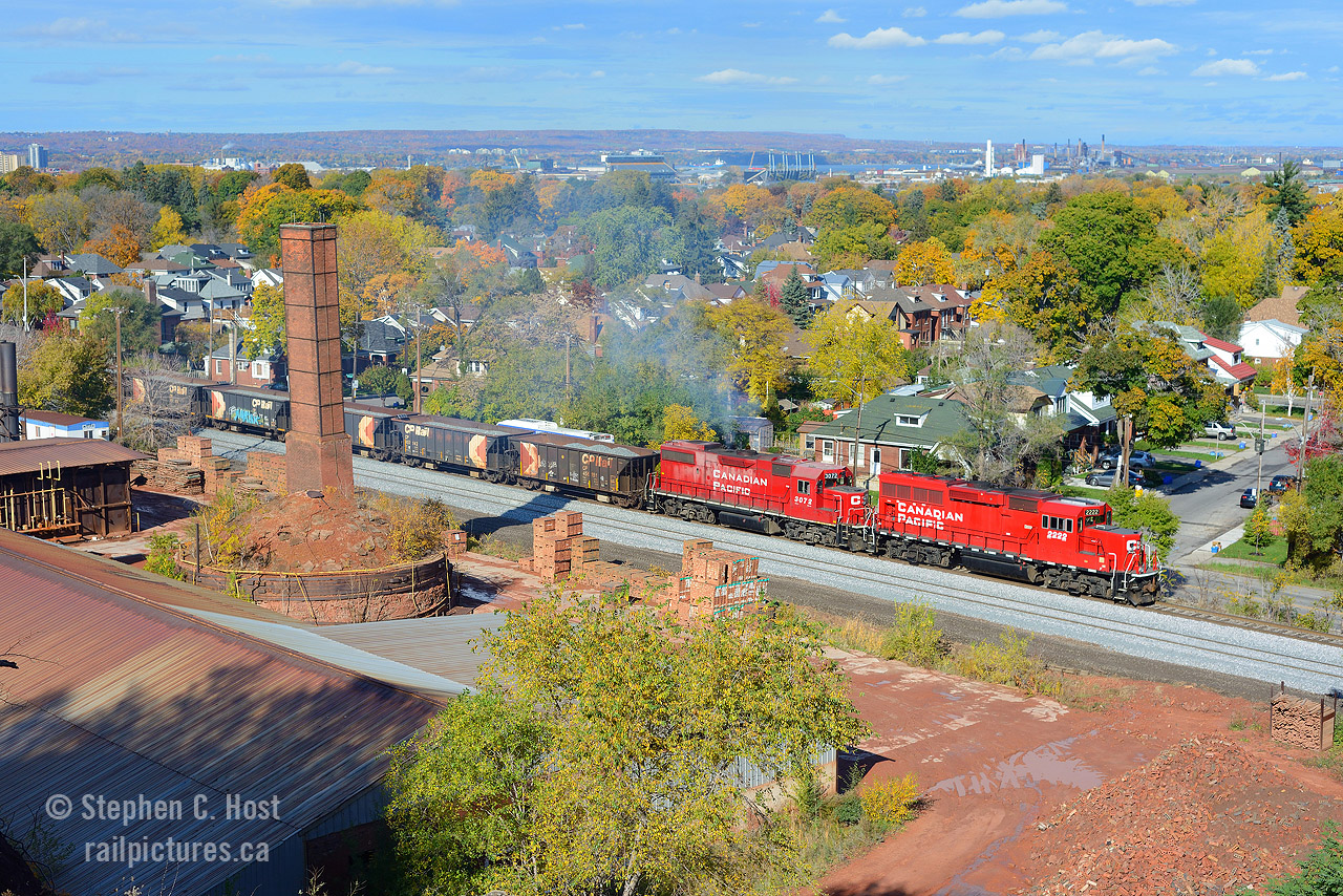 From up high, A CP Ballast train departs Kinnear on the former Toronto Hamilton and Buffalo Railway, with North Hamilton firmly in the background of this scene at the Brickworks. This ballast train was dumping between south siding switch kinnear and a spot near Rosseau Ave - with the track bed dug out completely (Ties sitting on dirt!) along much of the line, it's a wonder what's going on in Hamilton. New Siding extension? Clean-up after a Derailment? Anyone know?