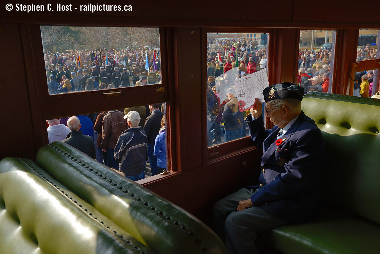 We will Remember them:  Sitting in 1923 built heavyweight coach CPR 1437 "Midway" - A member of the 404 Wing of the R.C.A.F.A (Waterloo) observes a sombre moment during ceremonies to remember those who paid the ultimate price fighting for our freedom, past and present. He remembers. We will remember them.