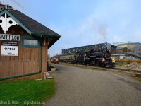 Old technology meets new - As an Engineer - to see the transformation of Waterloo Ontario over the last 15 years has been very welcome. I worked in Waterloo for 10 years and our company was a member of Communitech, where we met in the Perimeter Institute (PI) amongst other places to share ideas and best practices in the rapidly changing Tech industry. The building in the background is the institute, funded by technology magnate Mike Lazaridis who founded the once famous Research in Motion, creators of the Blackberry. When going to Lunch in the early days of my career, we'd often be next to Mike who favoured the same downtown Waterloo Queen St Vietnamese eatery we loved to go to, and as the tech industry grew, more buildings and condos have sprouted as companies grew ever larger.  Dr. Stephen Hawking, a world renowned physicist has a chair at the Institute, to give you an idea of how world class this facility is  - it is one of the top theoretical physics research centres in the world and it right  here in CANADA. We should all be proud of this achievement!
<br><br>
And what does this have to do with trains? Well, here we have the technology that helped put Waterloo on the map, in it's day the Steam Engine was the 'technology' similar to the Internet of today - passing by PI, which will lead the way in new discoveries to help us create tomorrow's technology. Waterloo is in a major state of transformation, soon the LRT will run trams up and down this very line. While the Vietnamese restaurant may be gone, it's only just the beginning of Waterloo's transformation, but the Railway continues on as an important part of Waterloo's future.