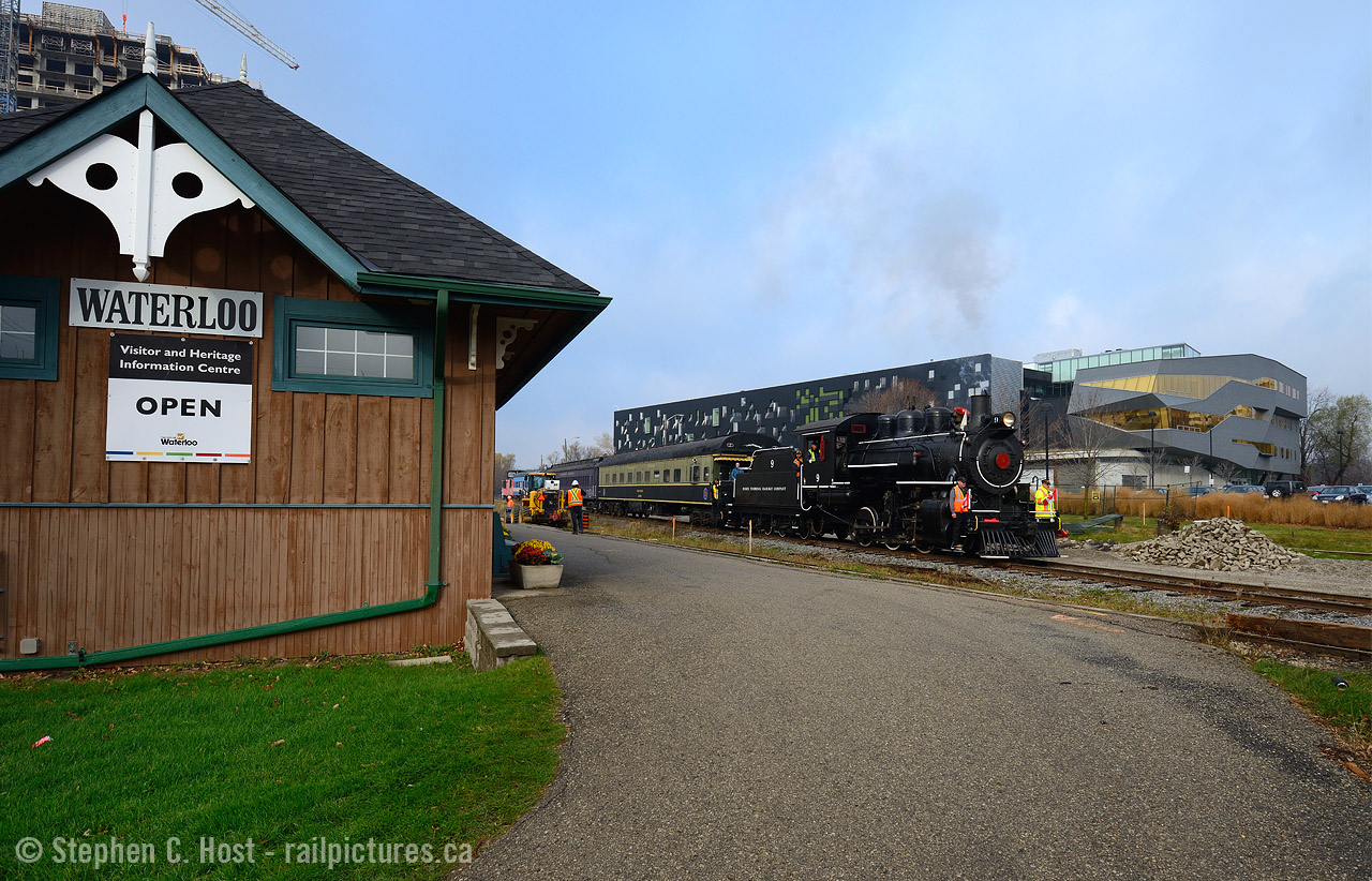 Old technology meets new - As an Engineer - to see the transformation of Waterloo Ontario over the last 15 years has been very welcome. I worked in Waterloo for 10 years and our company was a member of Communitech, where we met in the Perimeter Institute (PI) amongst other places to share ideas and best practices in the rapidly changing Tech industry. The building in the background is the institute, funded by technology magnate Mike Lazaridis who founded the once famous Research in Motion, creators of the Blackberry. When going to Lunch in the early days of my career, we'd often be next to Mike who favoured the same downtown Waterloo Queen St Vietnamese eatery we loved to go to, and as the tech industry grew, more buildings and condos have sprouted as companies grew ever larger.  Dr. Stephen Hawking, a world renowned physicist has a chair at the Institute, to give you an idea of how world class this facility is  - it is one of the top theoretical physics research centres in the world and it right  here in CANADA. We should all be proud of this achievement!

And what does this have to do with trains? Well, here we have the technology that helped put Waterloo on the map, in it's day the Steam Engine was the 'technology' similar to the Internet of today - passing by PI, which will lead the way in new discoveries to help us create tomorrow's technology. Waterloo is in a major state of transformation, soon the LRT will run trams up and down this very line. While the Vietnamese restaurant may be gone, it's only just the beginning of Waterloo's transformation, but the Railway continues on as an important part of Waterloo's future.