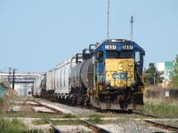 After spending a couple hours working the transfer to CN, the crew of 2697 are now backing their train into Sarnia yard where they will leave it for the afternoon yard job to pick apart. At the time, this was the last CSX unit in Ontario in the YN2 'bright future' paint scheme.