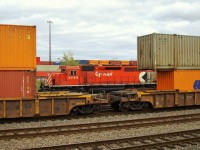 CP 5759 plays peek a boo between the containers on the well cars as it switches Vaughan Yard.